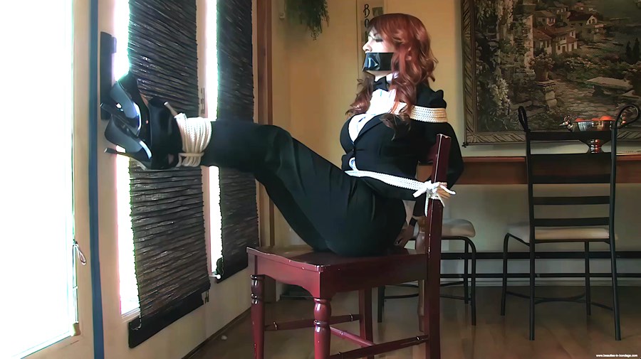 tied_up_girl_trying_to_reach_the_phone_upscaled_900.jpg